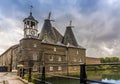 A view down Three Mill Lane towards the Clock Mill, part of the oldest tidal mills complex in the world in Lee Valley, London Royalty Free Stock Photo