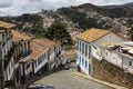 View down to steep cobblestone street and hills of historic baroque city Ouro Preto, UNESCO World heritage site, Minas Gerais,