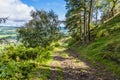 A view down the track leading down from the summit of Ilkley moor above the town of Ilkley Yorkshire, UK Royalty Free Stock Photo