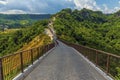 A view down the walkway between Bagnoreggio and the adjacent the hill top settlement of Civita di Bagnoregio in Lazio, Italy Royalty Free Stock Photo