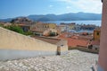 View downstairs to the port of old Portoferraio city with the fort Stella on the hill, Elba island.