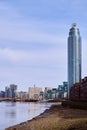 View downstream of River Thames at low tide with river bed exposed towards Vauxhall bridge and St George Wharf tower \ Vauxhall