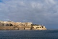 view of downtown Valletta and St. Elmo\'s Fire under an overcast sky Royalty Free Stock Photo