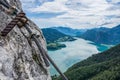 View from Drachenwand rock on Mondsee and Attersee. Via ferrata in Halstatt region, Austria. A steel rope is attached to the rock Royalty Free Stock Photo