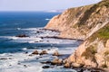 View of the dramatic Pacific Ocean coastline, with rocky cliffs, on a sunny day, Point Reyes National Seashore, California Royalty Free Stock Photo
