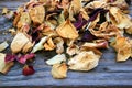 DRY ROSE PETALS ON A WOODEN BOARD Royalty Free Stock Photo