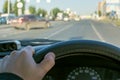 View of the driver hand on the steering wheel of a car Royalty Free Stock Photo