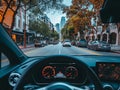 view from the driver\'s seat behind the wheel of a city street Royalty Free Stock Photo