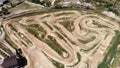 View from drone of professional enduro motorcycle racetrack. Motocross motorcycle track with enclosed dirt circuits with steep obs