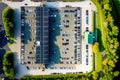 View from drone to large parking lot near shopping center, aerial view car parking