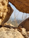 View of Dry grass land between the cave like rocks