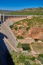 View of the dry spillway of a concrete dam during a long drought