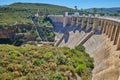 View of the dry spillway of a concrete dam during a long drought