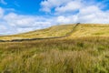 A view of a dry stone wall snaking across the Yorkshire Dales close to Malham Cove, Yorkshire Royalty Free Stock Photo