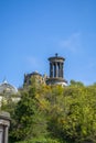 View of Dugald Stewart Monument with vegetation on top, in Edinburgh