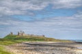 A view of Dunstanburgh Castle at low tide Royalty Free Stock Photo