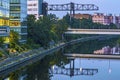 View at dusk along the Teltow Canal. You can see office buildings, at the top of the photo an industrial crane and a road bridge. Royalty Free Stock Photo