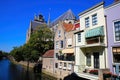 View on dutch water canal with residential houses and gothic church background - Dordrecht, Netherlands Royalty Free Stock Photo