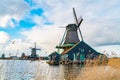 View of dutch windmills near the river Zaan in the Village of Zaanse Schans