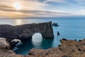 View of the Dyrholaey rock arch in Iceland at sunrise Royalty Free Stock Photo