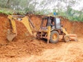 View earth mover vehicle with driver working over the earth surface