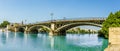 A view on the east bank of the river Guadalquivir towards the Triana Bridge in Seville, Spain