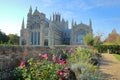 View of The Eastern part of the Cathedral from a public garden with colorful flowers in the foreground, Ely, Cambridgeshire