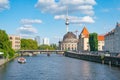 View from Ebert Bridge along River Spree to famous buildings of orange roof of Alexander Kaiser, Bode Museum and Berlin TV tower