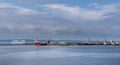 A view of Edinbrugh dock with various ships and a cruise ship