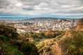 View of Edinburgh and Edinburgh castle from Arthur's Seat peak at sunset. Mountains and city center from above Royalty Free Stock Photo