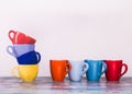 View of eight cups of coffee with different colors and form.