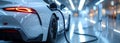 View of an Electric Car Charging Column and in the background a partial view of a car Royalty Free Stock Photo