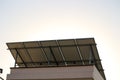 View electric solar panels set up on a rooftop