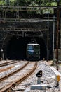 View of an electric train leaving a tunnel, Goeschenen, Switzerland Royalty Free Stock Photo