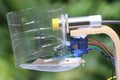 View of an electronic project made using micro servo and capacitive proximity sensor of npn type isolated on natural background