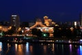 View of the embankment of Dnipro from the New Bridge at night, lights reflected in the water. Royalty Free Stock Photo