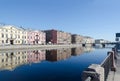 View of embankment of Fontanka River with reflections of buildins in water, St. Petersburg, Russia