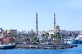 View of embankment of Hurghada with moored ships and beautiful mosque