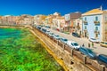 View of an embankment in Ortygia Ortigia, Syracuse. Picturesque cityscape of an ancient historical town on Sicily, Italy