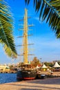 View of the embankment of Varna, moored sailboat with the port of Varna in the background Royalty Free Stock Photo