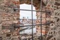 View through an embrasure in the castle wall of the fortress Feste Oberhaus near the three rivers city Passau with view on the cit Royalty Free Stock Photo