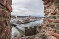 View through an embrasure in the castle wall of the fortress Feste Oberhaus near the three rivers city Passau with view on the cit Royalty Free Stock Photo