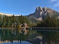 View of Emerald Lake in Yoho National Park, Canada in the Rocky Mountains with forest and lodge building reflected in water. Royalty Free Stock Photo