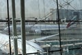 View of Emirates Airlines airplane parking on apron viewed from waiting lounge inside the terminal at Dubai Intenational Airport Royalty Free Stock Photo