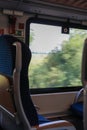 View of empty comfortable and clean blue seat inside German train Royalty Free Stock Photo