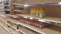 Empty grocery store shelves without product