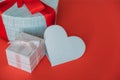 View of an empty heart made of paper next to gift boxes of different sizes Royalty Free Stock Photo