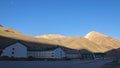 View of empty hotels and mountains without snow in the skiing area