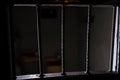 View of the empty jail cell through the bars of the doors Royalty Free Stock Photo