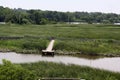 An empty pier at a freshwater marsh at the Russell W. Peterson Urban Wildlife Refuge in Wilmington, Delaware Royalty Free Stock Photo